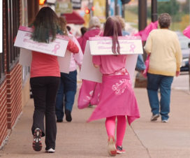 Two girls walking down sidewalk promoting breast cancer awareness - Mobile unit tour video