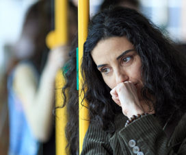 Woman on a bus coughing - Substance abuse: Stigma and making changes
