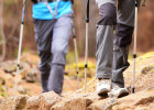 Two people hiking in the woods. Two people hiking in the woods. Prevent foot pain, ankle pain and blisters on feet with proper fitting shoes.