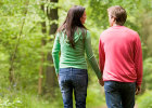 Couple walks in a forest