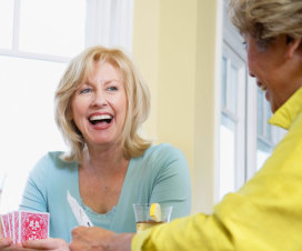 women laughing playing cards, hysterectomy | Shine365