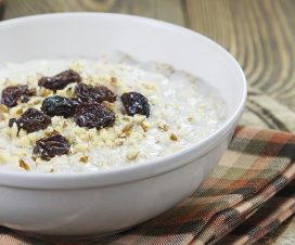 Bowl of oatmeal with raisins and walnuts – healthy eating