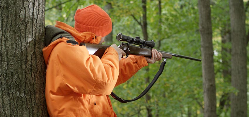 Hunter aiming gun