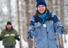 A couple snowshoeing in the woods