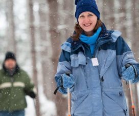 A couple snowshoeing in the woods