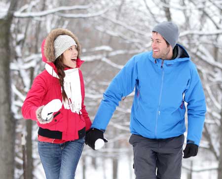 couple walking outside in the snow