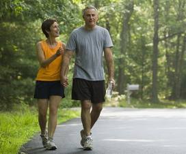 Woman and man walking outside for exercise