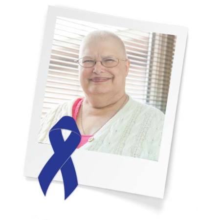 Colon cancer survivor with blue ribbon