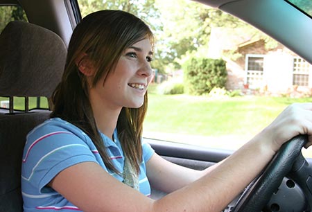 Teenage girl driving a car