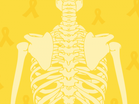 back of skeleton on yellow field with yellow ribbons for bone cancer awareness