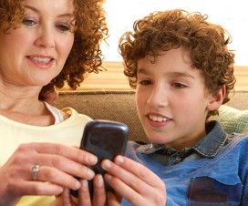 Mom giving son a cell phone
