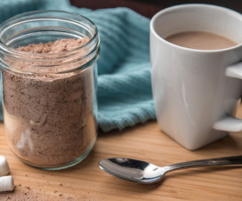 Hot mocha mix in a jar with a cup of cocoa
