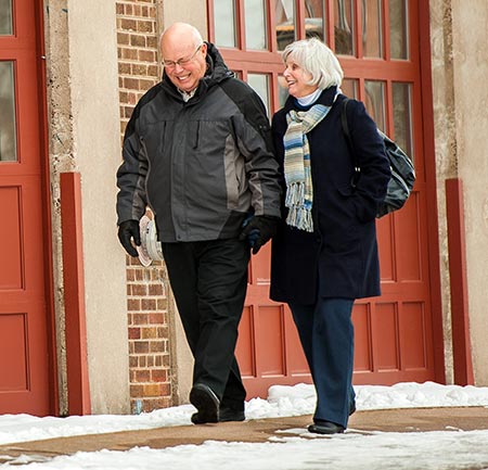Senior couple walking outside in winter