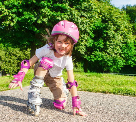 skater girl wearing pink pads