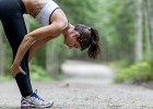 Woman stretching in exhaustion after workout: Is it possible to over-exercise?