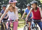 Two teens ride bikes with their parents: Are teenagers getting enough exercise?