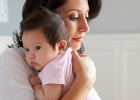 Mother holding baby in close embrace - Dealing with postpartum depression