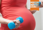 Pregnant woman exercising with free weights - Pregnancy and exercise - Myth Busters