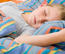 Young boy sleeping - Managing voiding problems