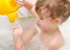 Child taking a bath - How often should kids take a bath?