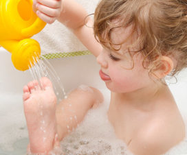 Child taking a bath - How often should kids take a bath?