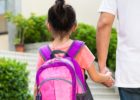 Father walking young daughter to school - Back to school anxiety