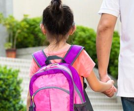 Father walking young daughter to school - Back to school anxiety