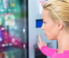 Woman choosing items at a vending machine