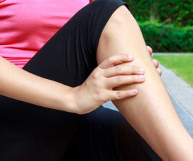 Woman massaging her calf - When to worry about leg cramps