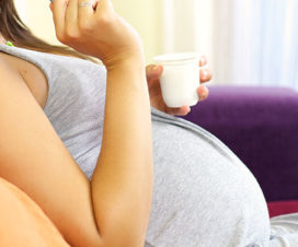 Pregnant woman eating yogurt - Pregnancy nutrition