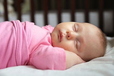 Baby sleeping in crib - SIDS awareness