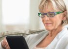 Woman looking at a tablet - Ways to find a new medical provider