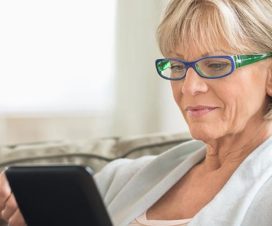 Woman looking at a tablet - Ways to find a new medical provider