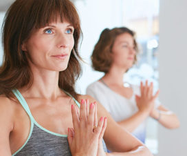 Woman practicing yoga - Can you reduce your risk for recurrence?