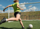 High school soccer player practices kicking goals - Growth plate injuries
