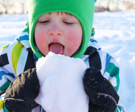 Kid eating a piece of snow - Is eating snow safe?