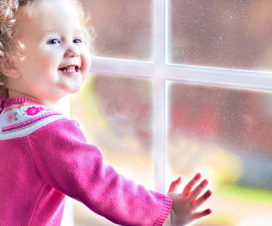 Young girl playing by a window - 3 things you should know about lead poisoning