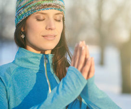 Woman meditating outside - meditate holiday stress away