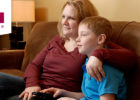 Mom and son sitting on couch - Care My Way virtual visit