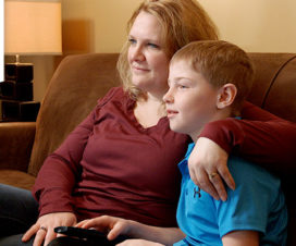 Mom and son sitting on couch - Care My Way virtual visit