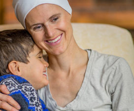 Woman cancer survivor and young boy