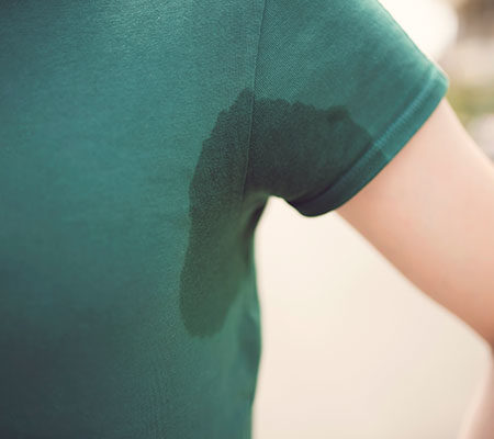 A teen's sweaty armpit that is causing body odor