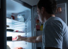 Man opening fridge for late night snack