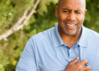 Man holding his chest - Chest pain discomfort