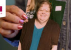 Woman holding a photograph and Marshfield Clinic icon - Patient weight loss story