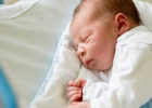 Baby sleeping in a nursery bed - NICU