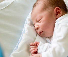 Baby sleeping in a nursery bed - NICU