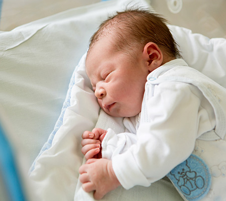 Baby sleeping in neonatal intensive care units NICU