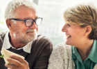 Senior man and woman eating breakfast together smiling - Cardiotoxicity