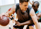 Middle-aged men playing basketball - New exercise program precautions